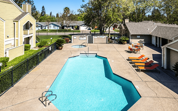Pool with lounge chairs | Riverstone apts in Sacramento, CA 95831